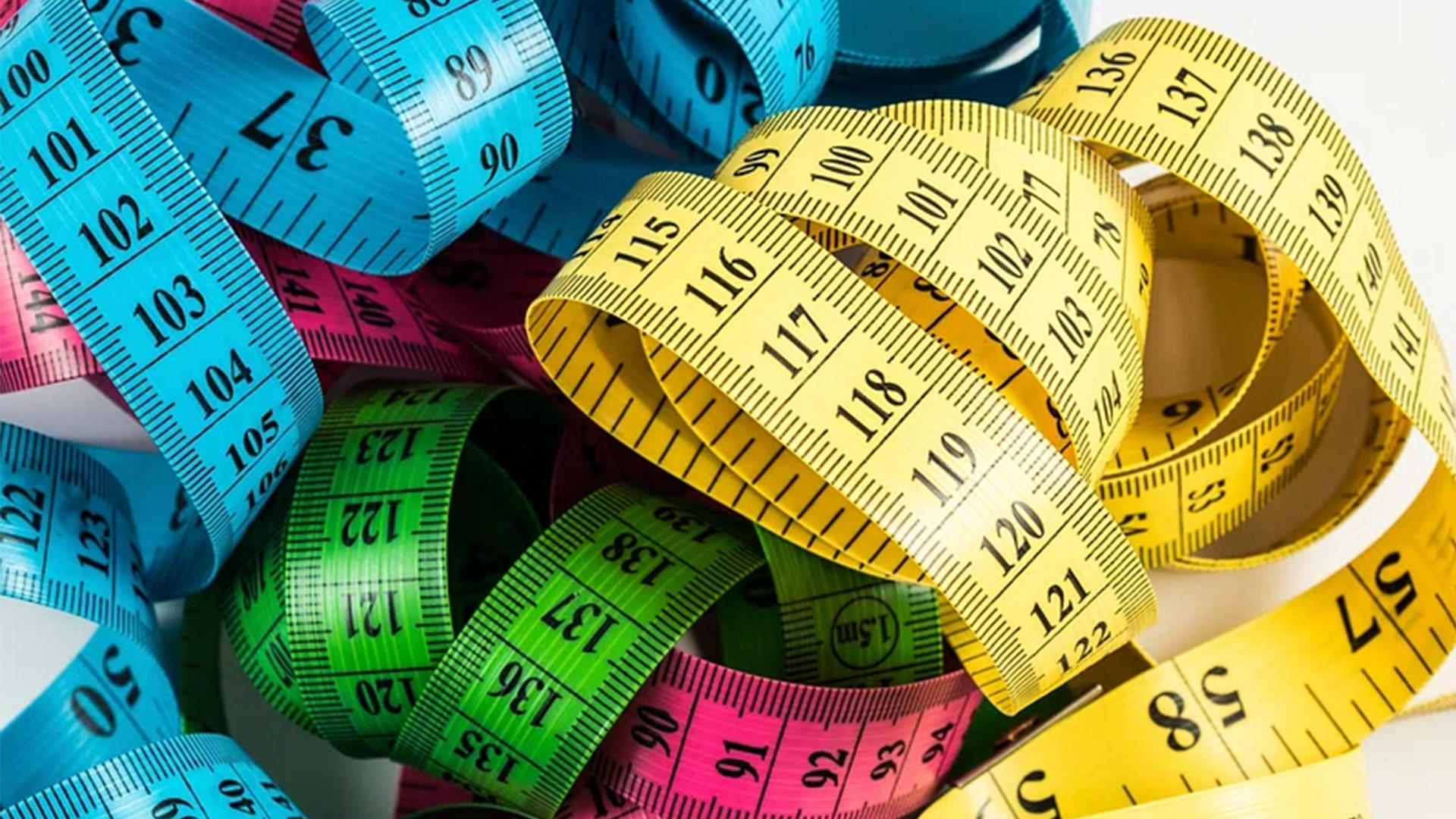 a colorful pile of tape measures.
